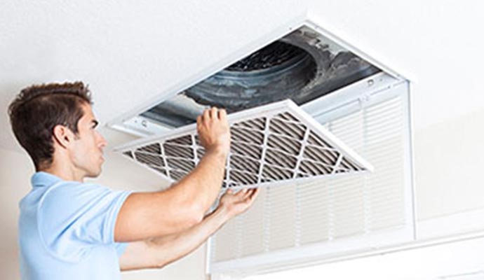 man holding air duct cleaning