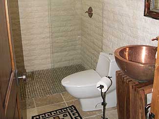 Bathroom with Copper Sink, and Glass Shower.