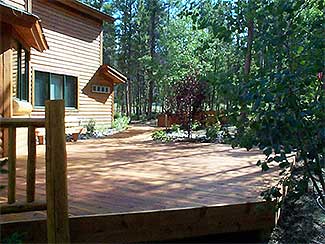 Wooden Patio Deck with Rustic Wood Railings and Sauna
